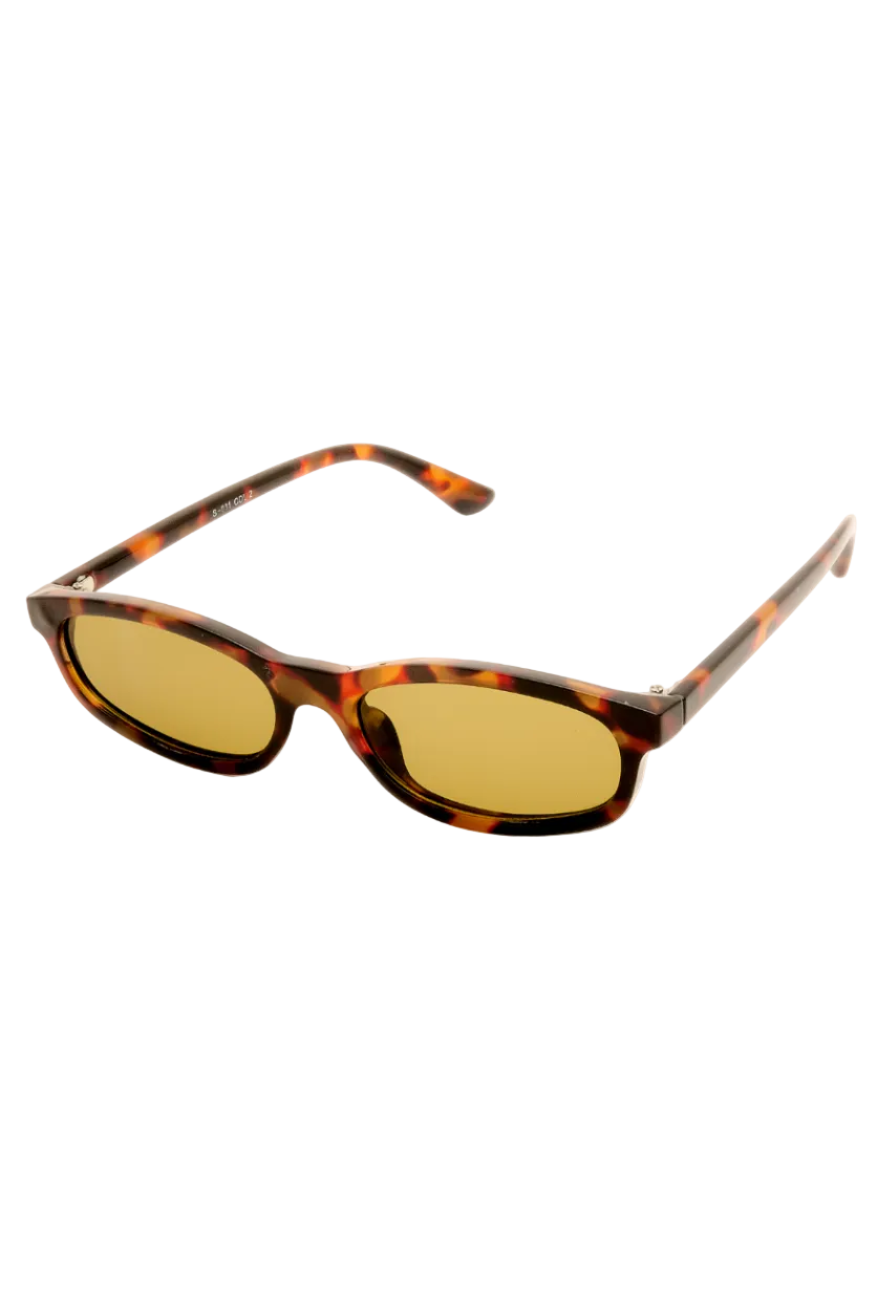 Oval sunglasses with a brown and black tortoiseshell frame and yellow tinted lenses, shown on a plain white background.