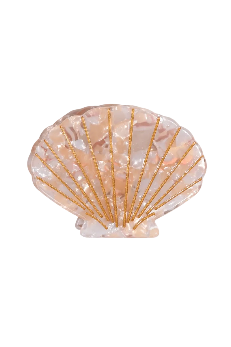 A scallop shell-shaped hair accessory with a translucent peach and white marbled pattern, accented by gold metallic lines radiating from the center, shown on a plain white background.