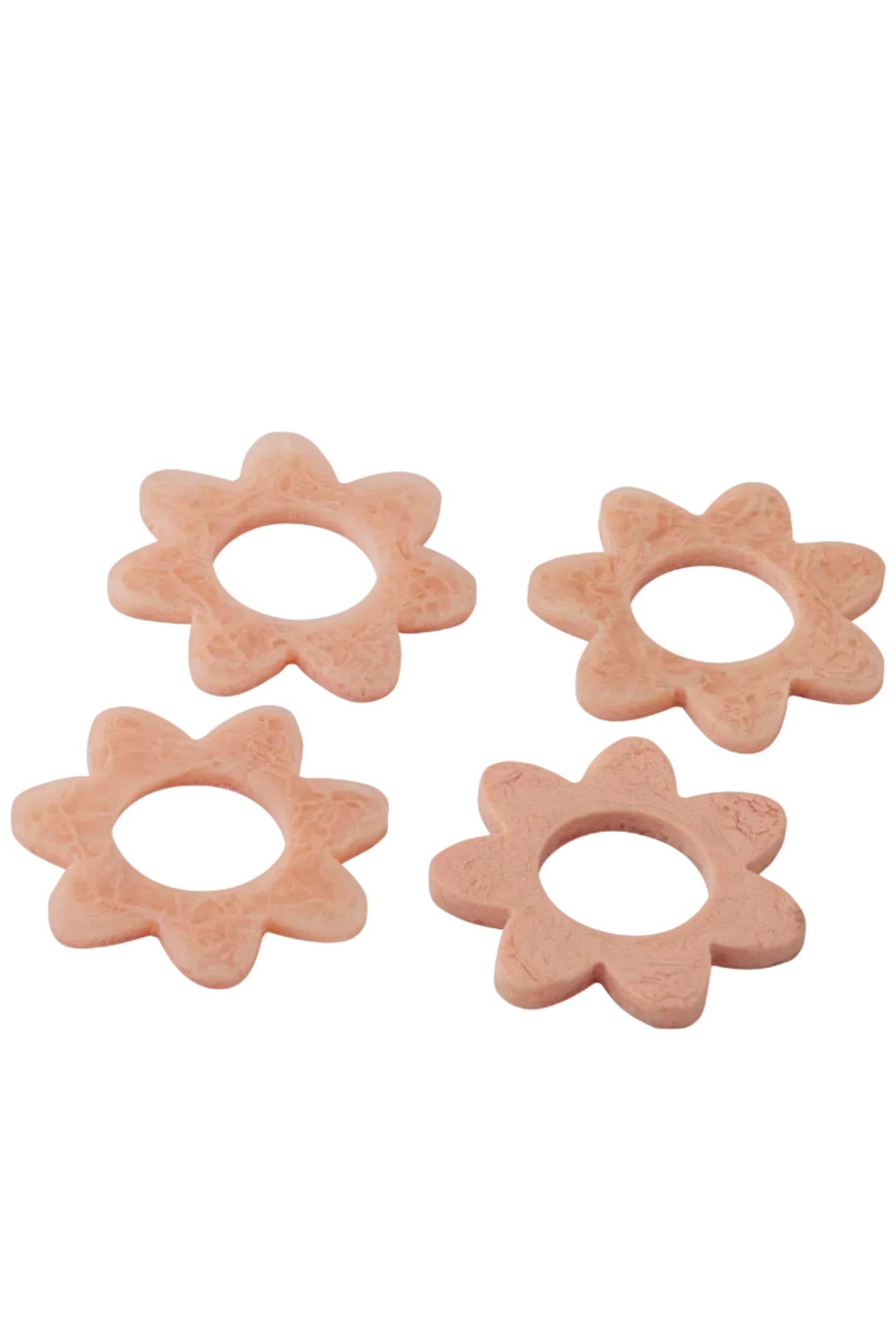 Four flower-shaped baby teether toys on a white background