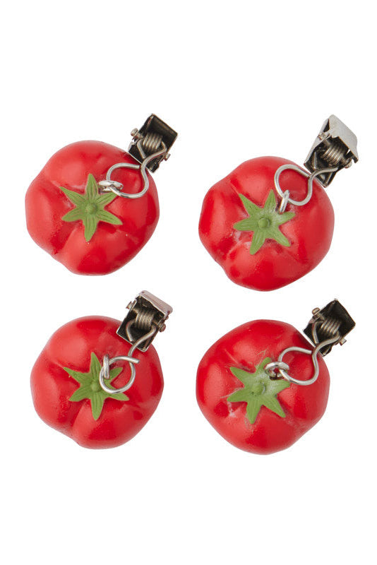 Four red tomato-shaped hair clips with green stem details and silver metal spring clips, arranged in a 2x2 grid on a white background.