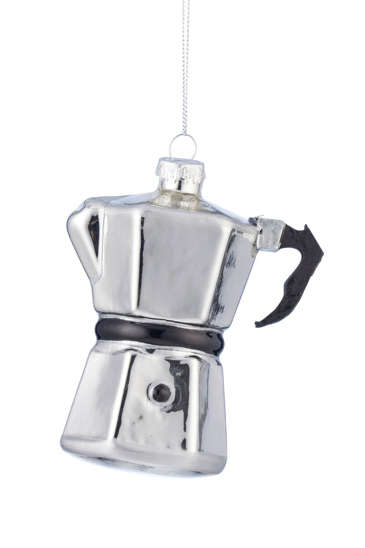A silver metallic moka pot Christmas ornament hanging from a thin silver string against a plain white background.