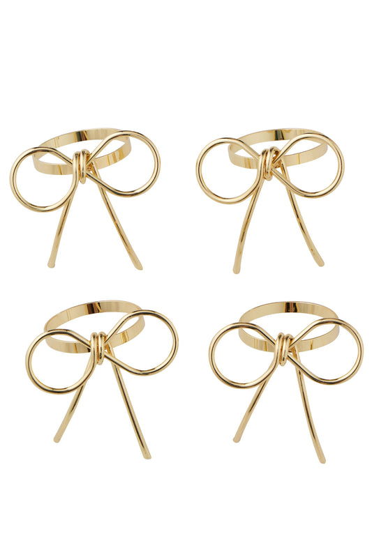 Four gold bow-shaped metal rings arranged in a 2x2 grid on a plain white background.