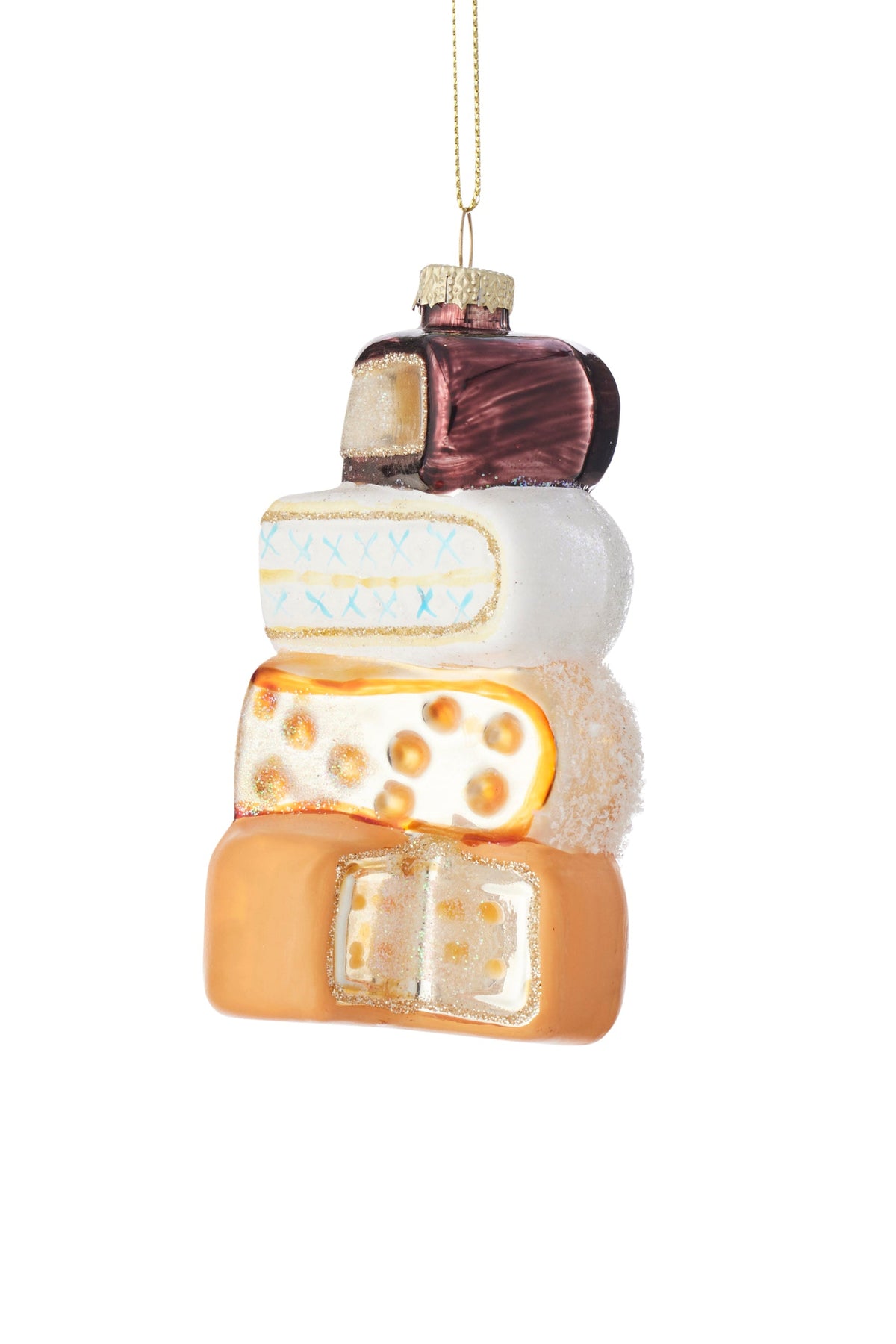 A stacked assorted cheeses ornament hanging by a gold string, featuring  different shades of orange, cream, white, and dark red on a plain white background.
