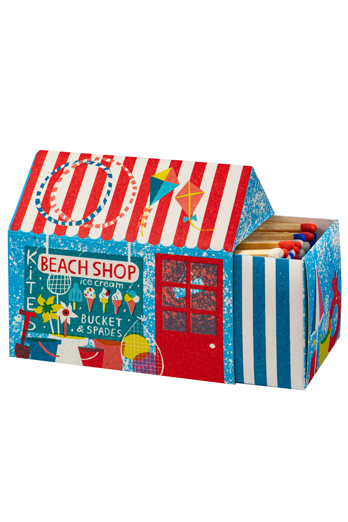 A decorative matchbox shaped like a beach shop tent, featuring red and white stripes on the roof, a blue side panel with 'BEACH SHOP' and ice cream graphics, and a striped front panel. The open top reveals wooden matches with red and blue tips.