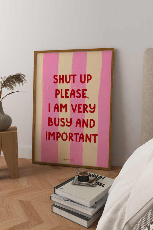 Framed artwork with text in a bedroom setting