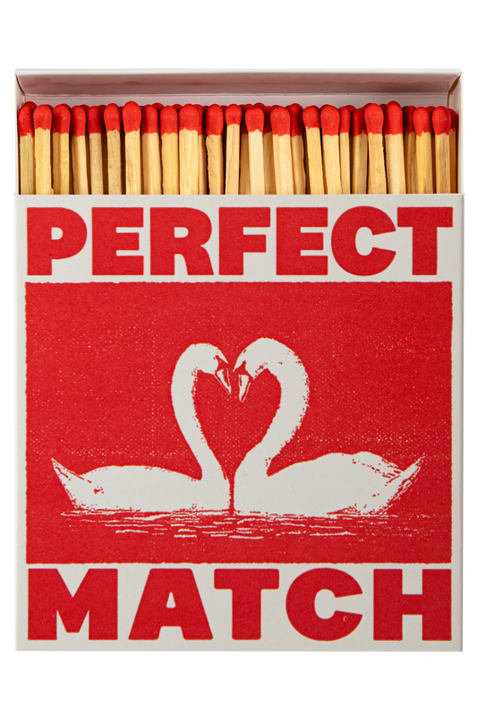 Matches in a box with 'Perfect Match' text and swan design on a red background