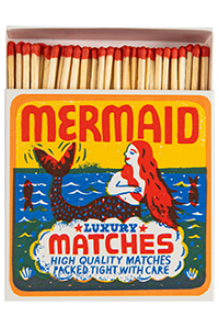 Matchbox with mermaid design on a white background