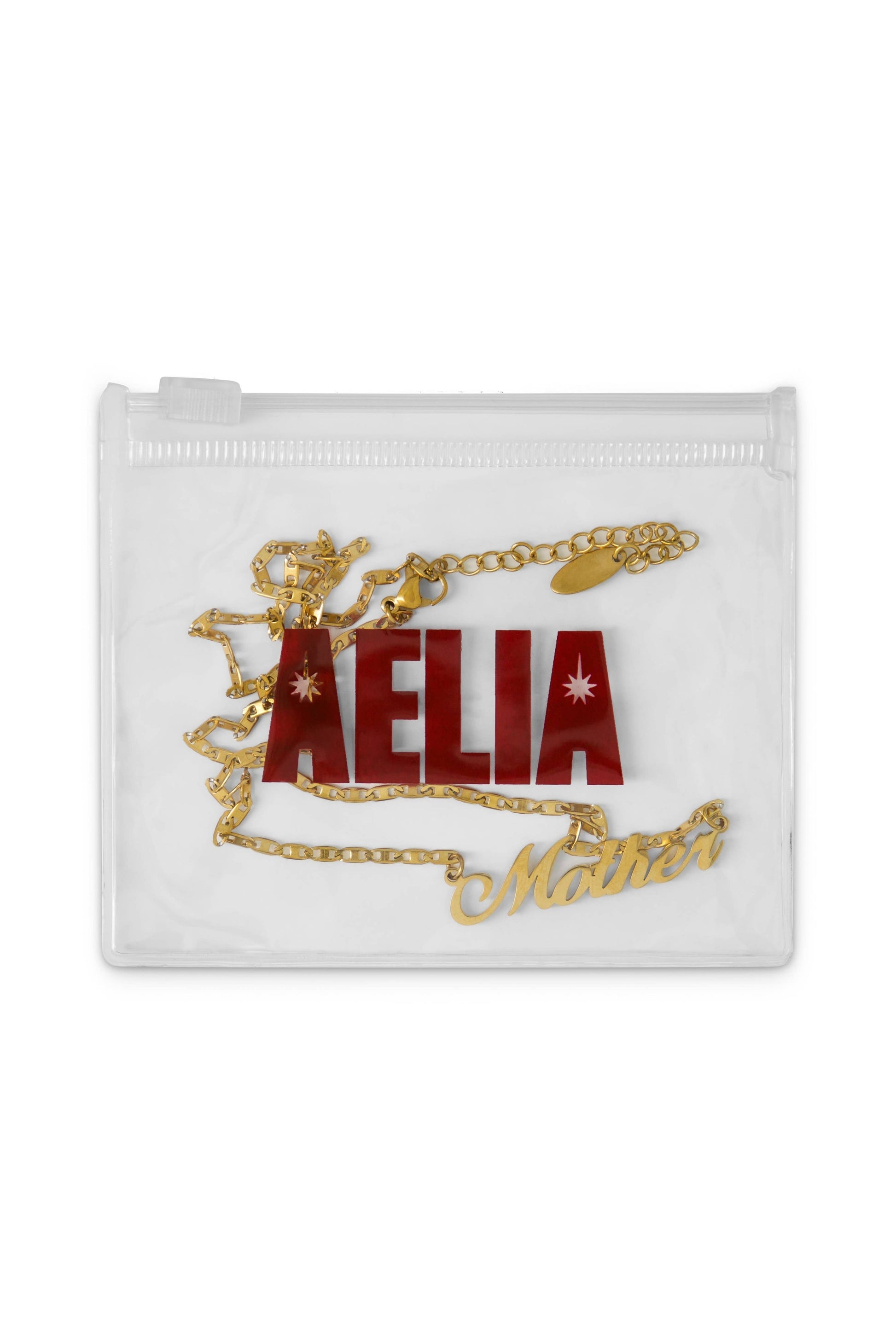 Clear pouch with gold chain and red text on a white background