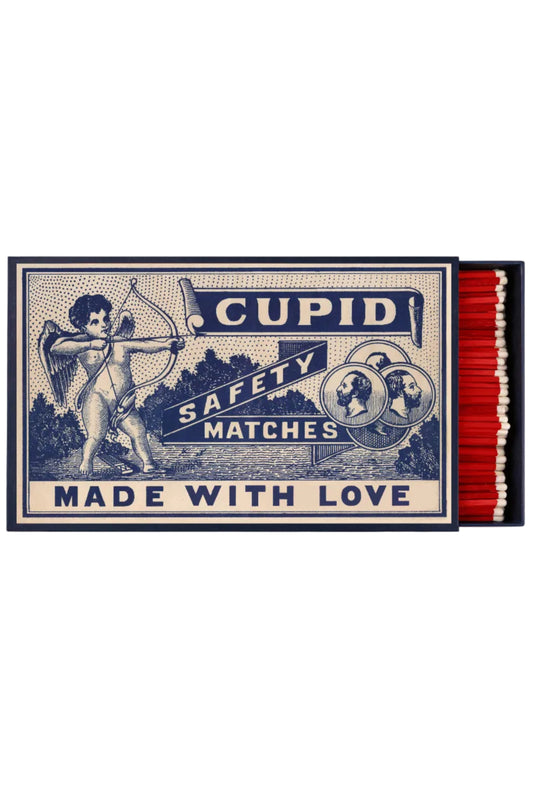 Matchbox labeled 'Cupid Safety Matches Made with Love' on a white background