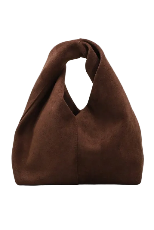 A dark brown suede hobo handbag with a unique split top handle, photographed against a neutral light beige textured background.