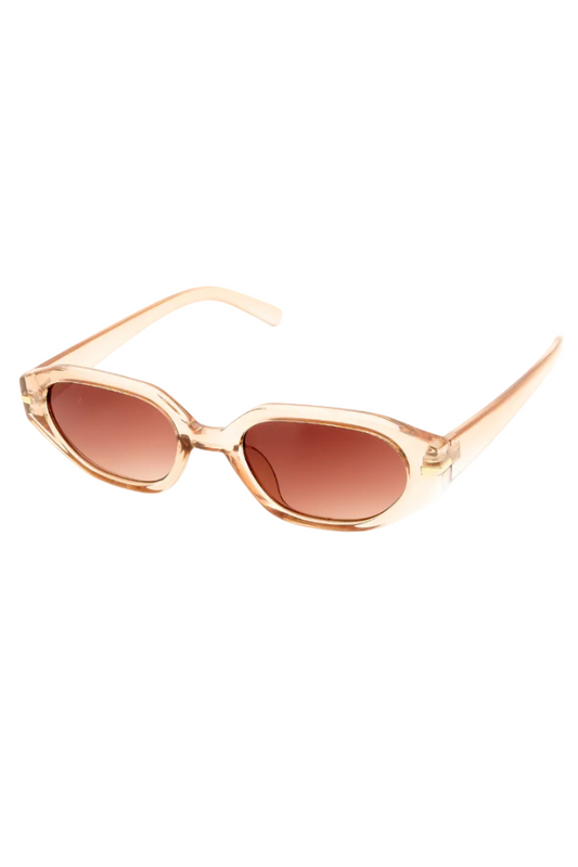Oval sunglasses with a translucent peach frame and brown gradient lenses, shown on a plain white background.