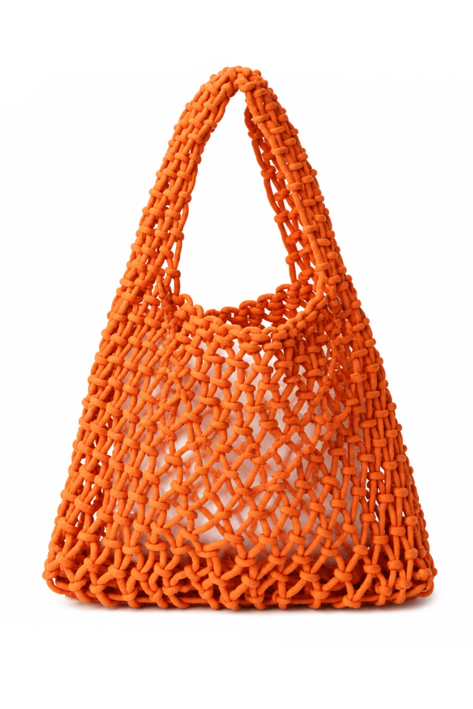 An orange woven mesh shoulder bag with integrated top handles, photographed on a clean white studio background.